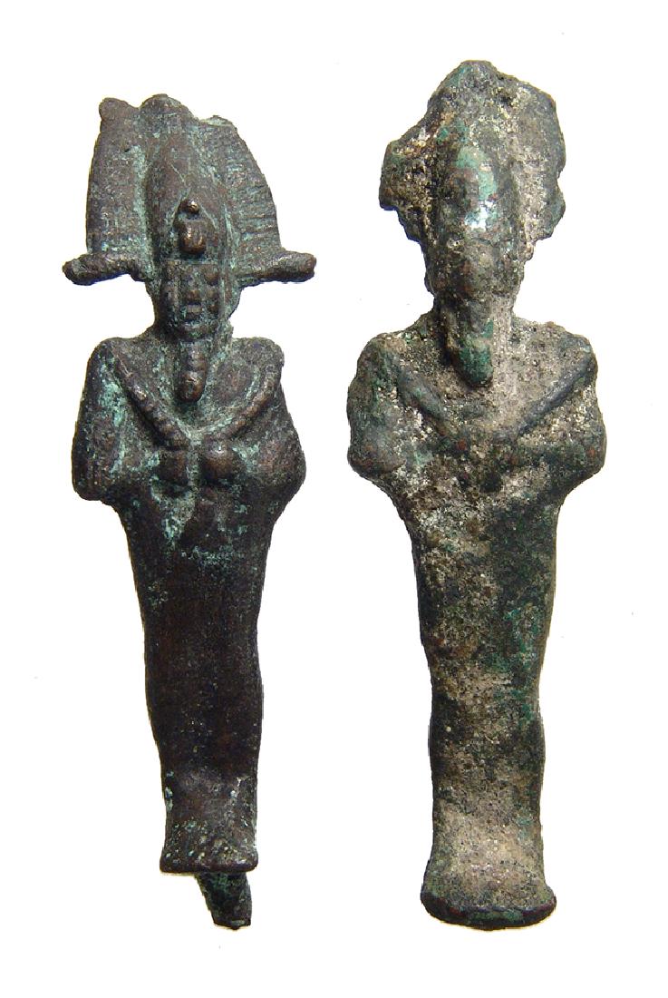 A nice pair of Egyptian bronze figurines of Osiris: A nice pair of Egyptian bronze figurines of Osiris, Late Period, c. 664 - 332 BC, each mummiform, wearing Atef crown with uraeus and false beard, arms folded at chest and holding a crook and flail; re