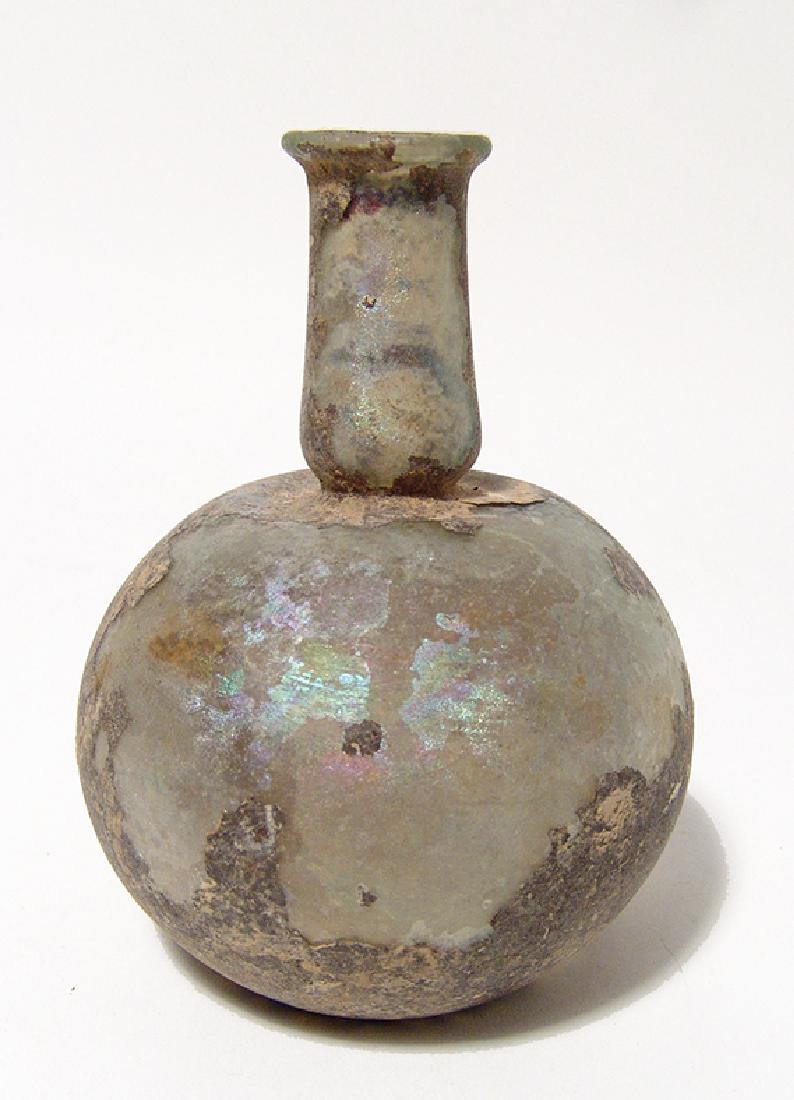 A Roman pale yellow-green glass bottle (1 of 3)