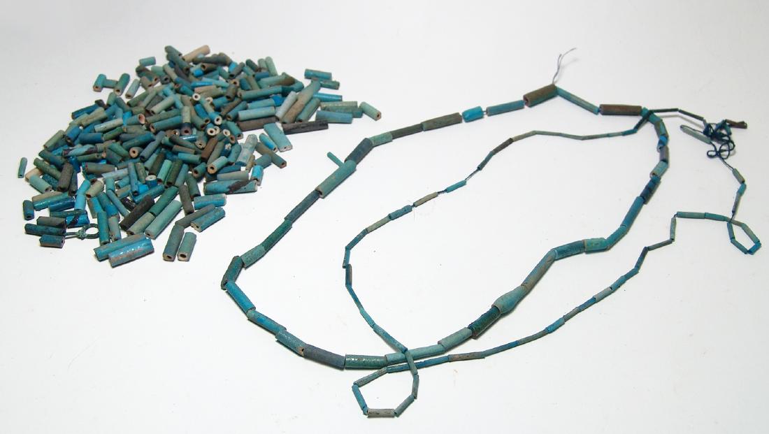 A nice lot of Egyptian faience beads: A nice lot of Egyptian faience beads, 3rd Intermediate to Late Period, c. 1075 - 332 BC, all tubular shaped of varying sizes and in shades of blue. Ex Ernest Freemark collection, acquired 1913 - 1915;