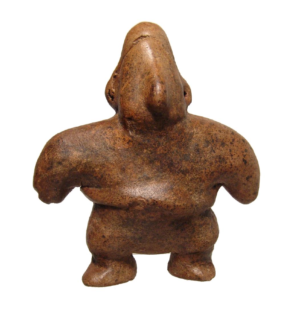 A choice Colima Archaic-Style standing woman: A choice Colima Archaic-Style standing woman, West Mexico, c. 100 BC - AD 200, of large stature and of unusually thick and solid construction she is wearing a skirt with thick girdle, ear spools and a