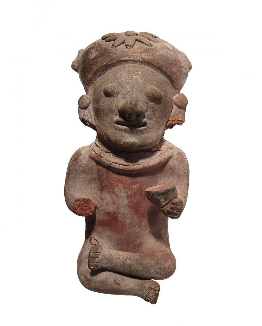 A Bahia seated male figure, Ecuador: A Bahia seated male figure, Ecuador, c. 5th Century BC - 5th Century AD, legs crossed, wearing a tall headdress with floral decoration and holding cup in hand. H: 7 in (17.8 cm). Well-preserved with l