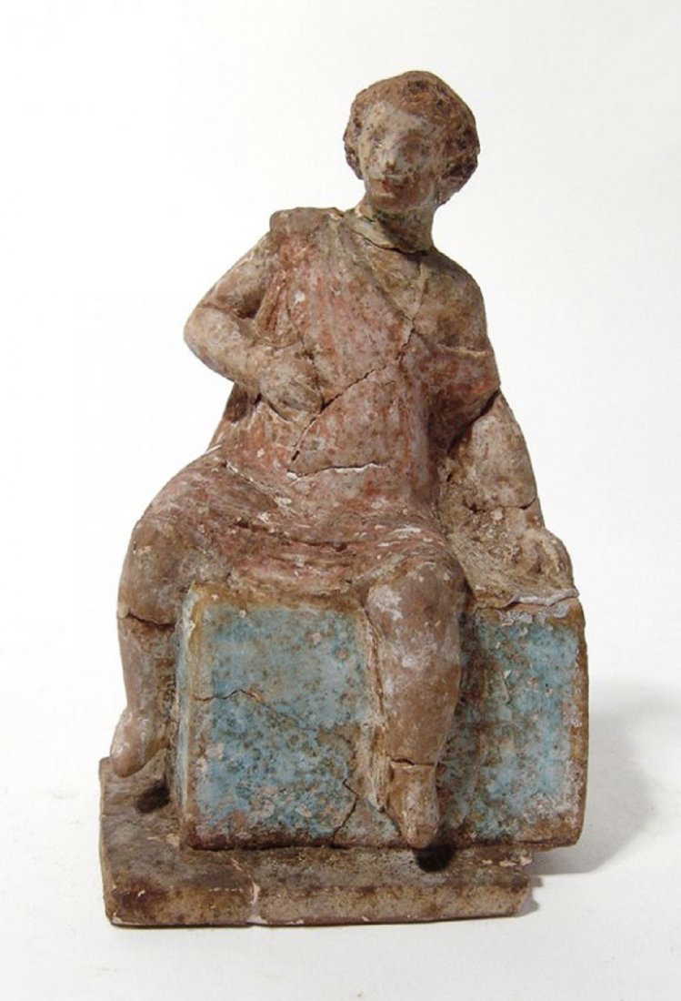 A Greek terracotta figure of a youthful man