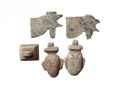 A lot of 5 Egyptian stone amulets, Late Period: A lot of 5 Egyptian stone amulets, Late Period, c. 664 - 30 BC, and include a pair of 'Eye of Horus' amulets, a pair of choice 'ib' or heart amulets, and an amulet of the Ben-Ben stone. Largest 27 x 1