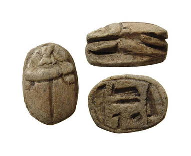 An Egyptian steatite scarab with Amen-Re inscription: An Egyptian steatite scarab, Late Period, c. 664 - 332 BC, the base with a protective inscription referring to the god Amen-Re. L: 1.5 cm. Ex Wiltshire, UK private collection.