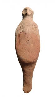 A hand-modeled Egyptian terracotta ushabti: A hand-modeled Egyptian terracotta ushabti, Late New Kingdom, c. 1200 - 1075 BC, a style found in the Egyptian territories of the Levante. Stylized in form with bald head, large eye and detailed