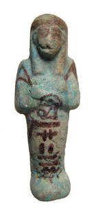 Egyptian bicolor faience ushabti, 3rd Intermediate: An Egyptian bicolor faience ushabti, 3rd Intermediate Period, 21st Dynasty, c. 1075 - 943 BC, mummiform, wearing tripartite wig and seshed headband, arms folded at chest hands with pick and hoe