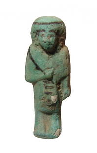 An Egyptian faience Reis or Overseer ushabti: An Egyptian faience Reis or Overseer ushabti, 3rd Intermediate Period, 22nd Dynasty, c. 945 - 715 BC, wearing characteristic kilt and rectangular apron of everyday life, short wig with seshed head