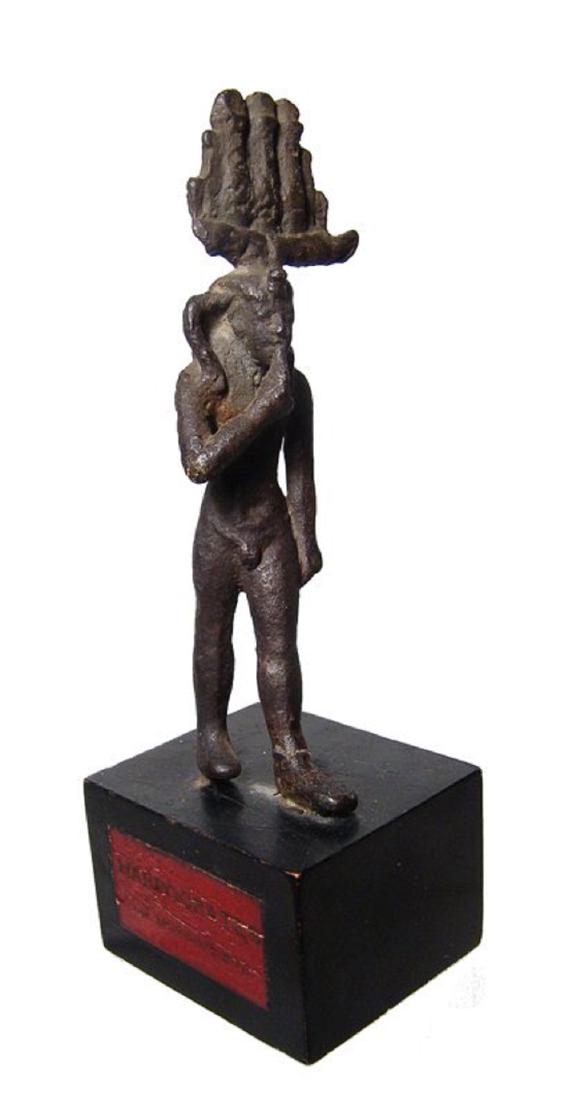 An attractive Egyptian bronze figure of Harpokrates: An attractive Egyptian bronze figure of Harpokrates, Late Period, c. 664 - 343 BC, depicted nude, striding forward wearing Hem-Hem crown and side lock of youth, right finger to mouth, left arm pendant
