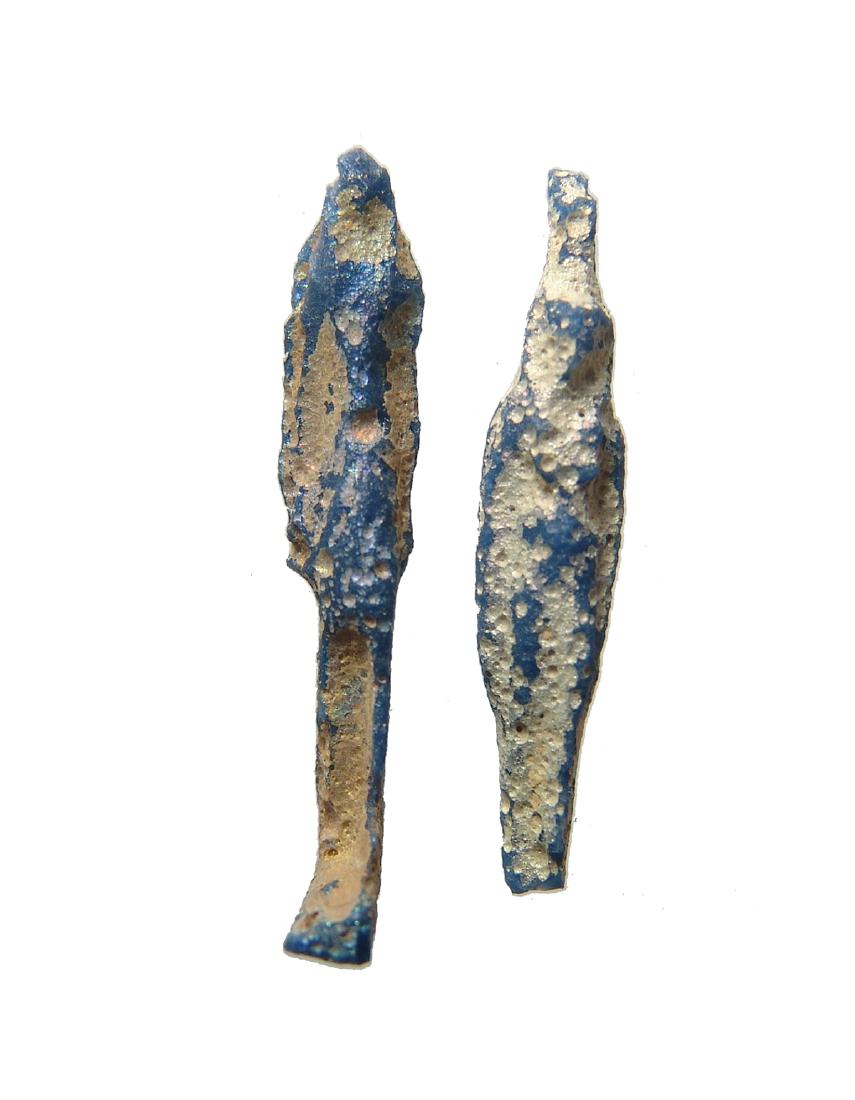 A pair of Egyptian blue glass amulets, Late Period: A pair of Egyptian blue glass amulets, Late Period, c. 664 - 30 BC, in a deep cobalt blue glass, one representing Isis the other an uncertain deity. 37 mm & 39 mm. Light iridescence, glass amulets are