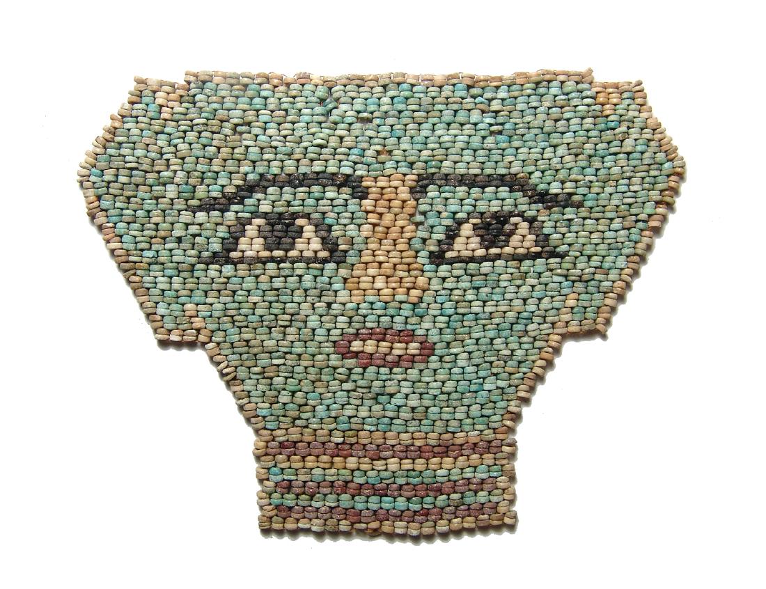 Beautiful Egyptian faience beads shaping a face mask (1 of 2)