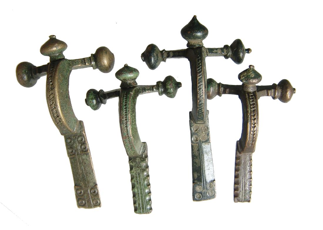 A very nice group of 4 Roman crossbow fibulae (1 of 6)