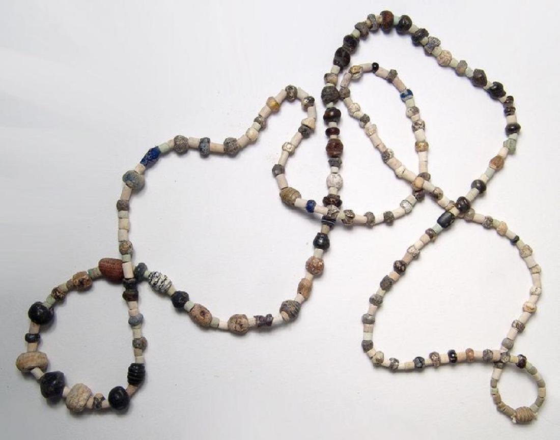 Strand of mixed ancient stone, glass, and faience beads (1 of 2)