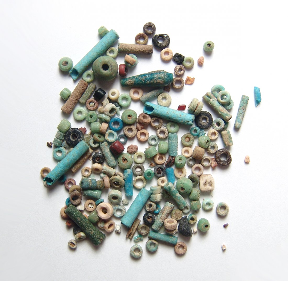 A group of 100+ Egyptian multicolored faience beads: A group of 100+ Egyptian multicolored faience beads, Late Period, c. 664 – 30 BC, most are well-preserved with good color. Ex Los Angeles private collection.