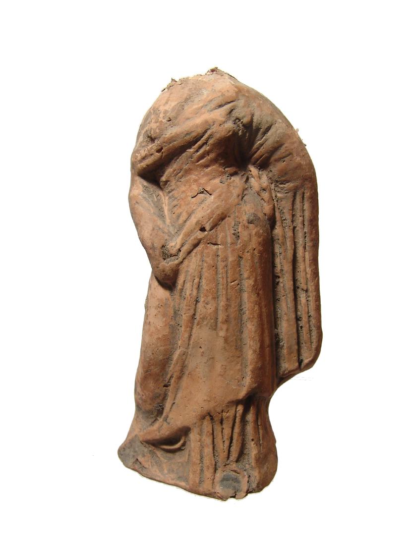 A Greek terracotta torso of a female figure (1 of 3)