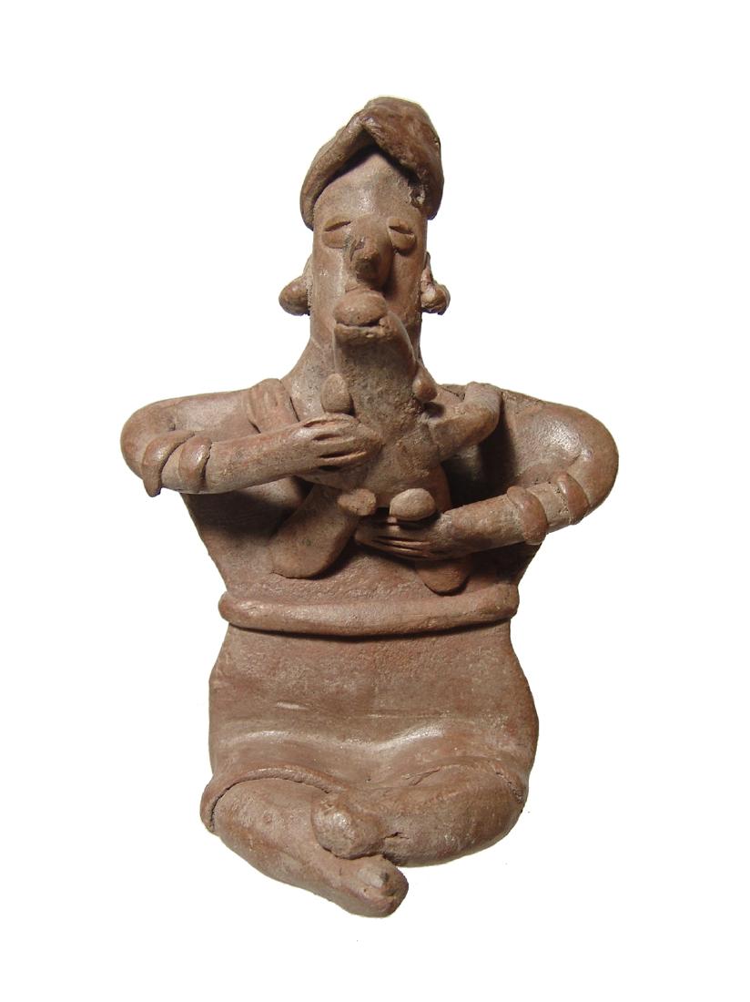 A Colima figure of a mother holding her child (1 of 4)
