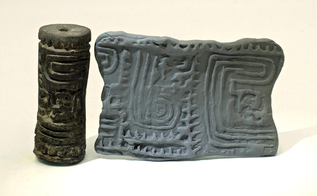 A choice LaTolita sello (roller stamp) from Ecuador: A choice LaTolita sello (roller stamp) from Ecuador, c. 500 BC - AD 400. This perforated sello is 2 ¾ in long, 1 1/8 in in diameter and is decorated with a pair of animated monkeys and geometric desi
