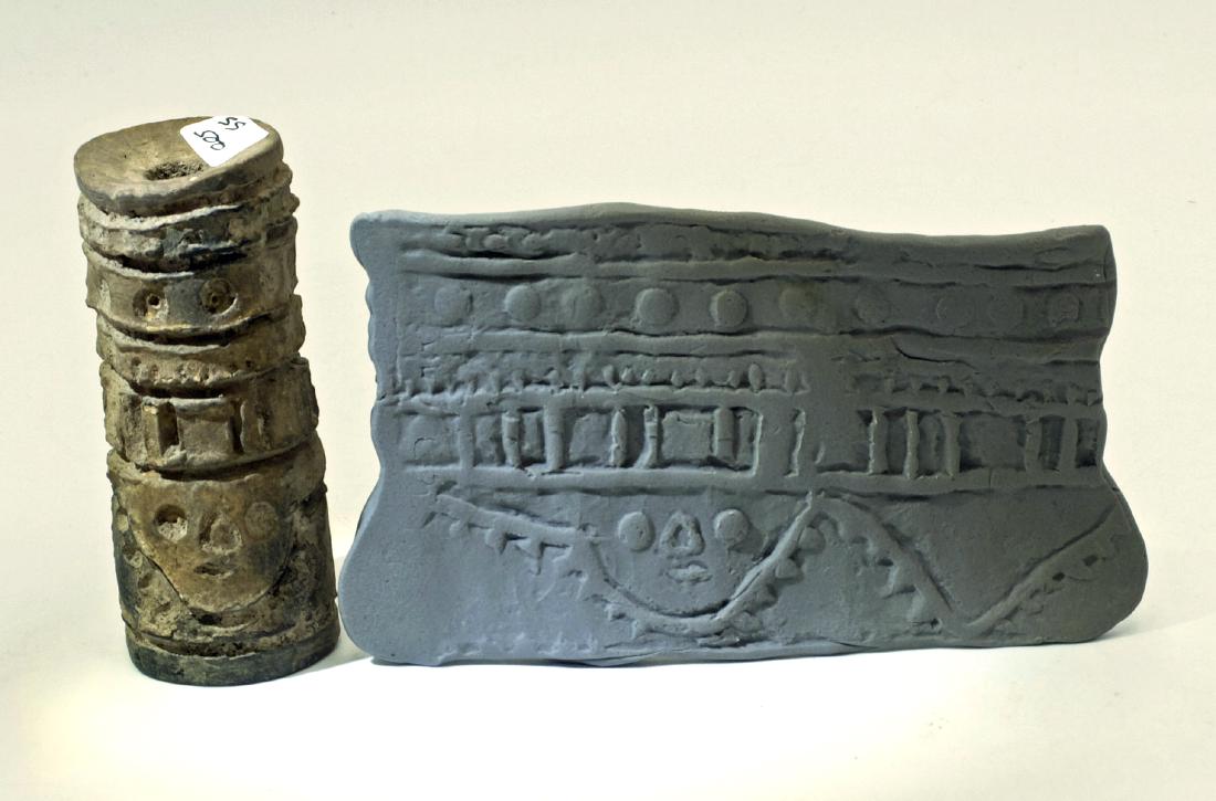 A choice LaTolita sello (roller stamp) from Ecuador: A choice LaTolita sello (roller stamp) from Ecuador, c. 500 BC - AD 400. This hollow sello is 3 in long, 1 ¼ in in diameter and is decorated with a death mask and bands of geometric designs. Good min