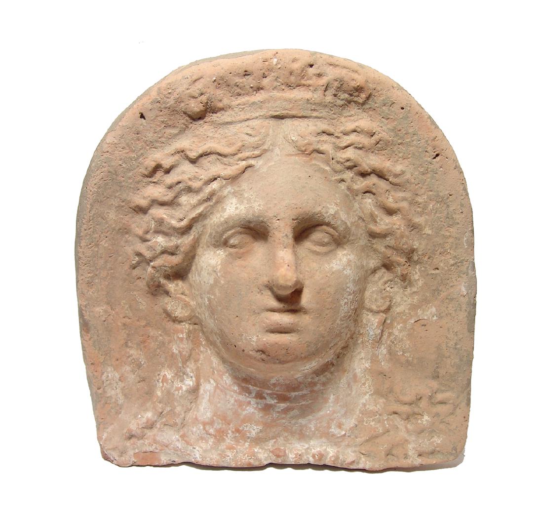 Hellenistic terracotta antefix depicting a goddess (1 of 3)