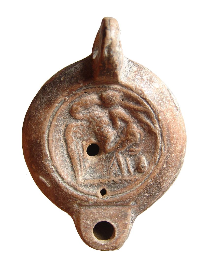 Roman pottery oil lamp depicting Leda and the Swan (1 of 2)