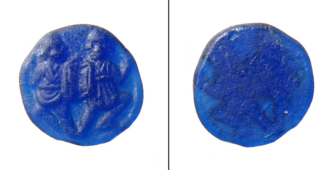 A choice Roman blue glass counter with soldiers: A choice Roman blue glass counter with soldiers, c. 1st - 4th Century AD, the armored combatants wearing short tunics and brandish shields and spears. Remarkably well-detailed with rich blue transluce