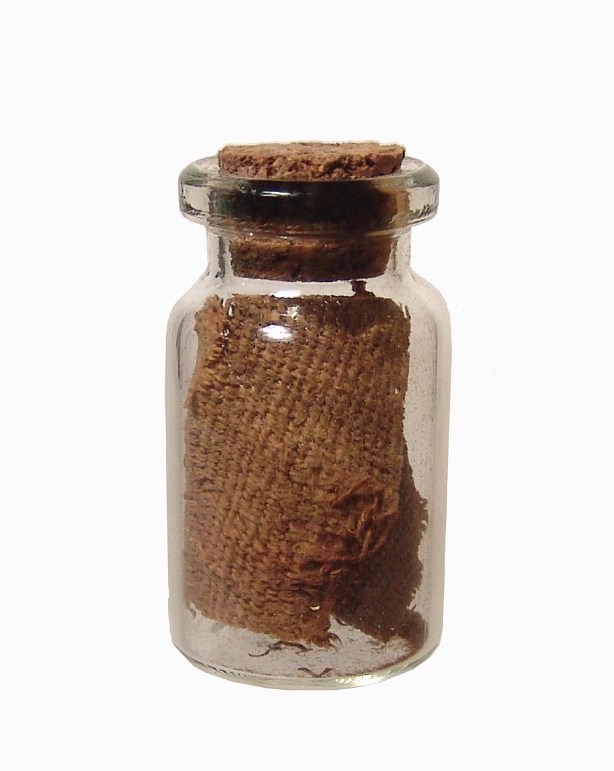 Bottle of Egyptian linen mummy-wrappings: A bottle of mummy-wrappings dating from Egypt's Third Intermediate Period c. 900-700 BC. Tan to brown color, recovered from a sarcophagus owned by BC Antiques (Los Angeles, CA) gallery closed in the 1