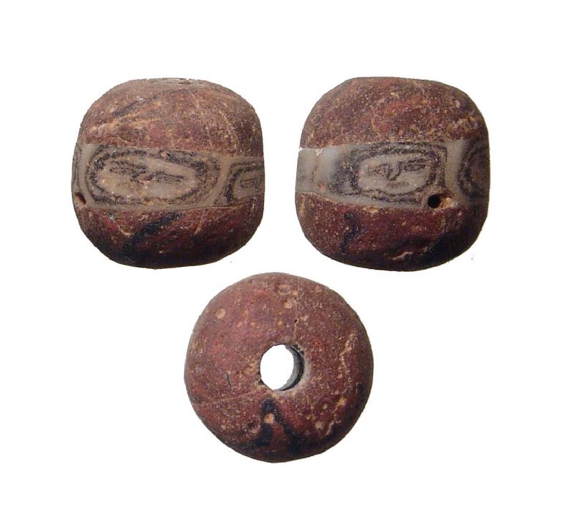 A nice Roman red glass face bead (1 of 1)
