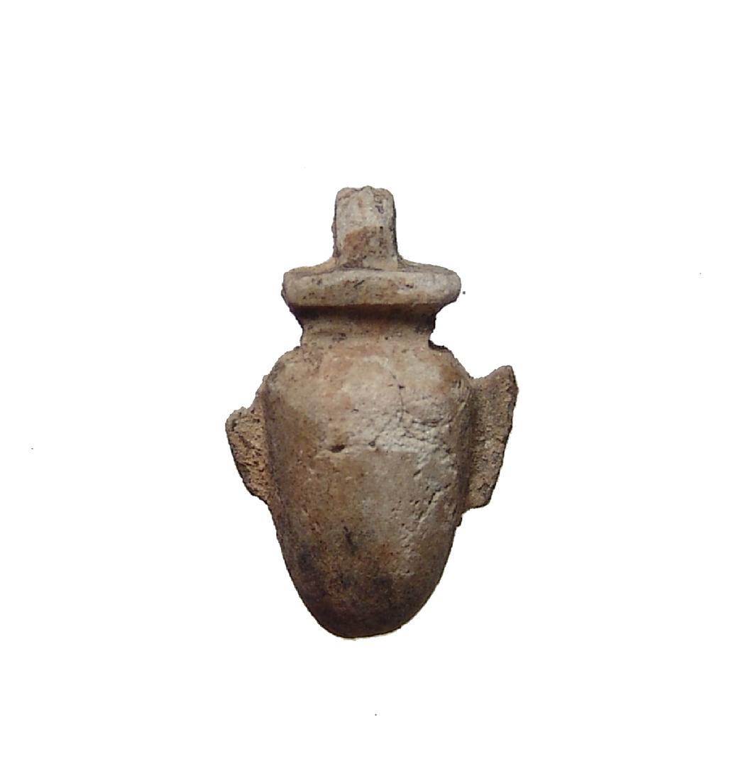 Egyptian stone 'ib' or heart amulet, Late Period: An Egyptian stone 'ib' or heart amulet, Late Period, c. 664 - 30 BC, carved in a tan colored stone with deposits throughout. 23 x 14 mm. Ex Boston Museum of Fine Arts de-accession; previously in the c