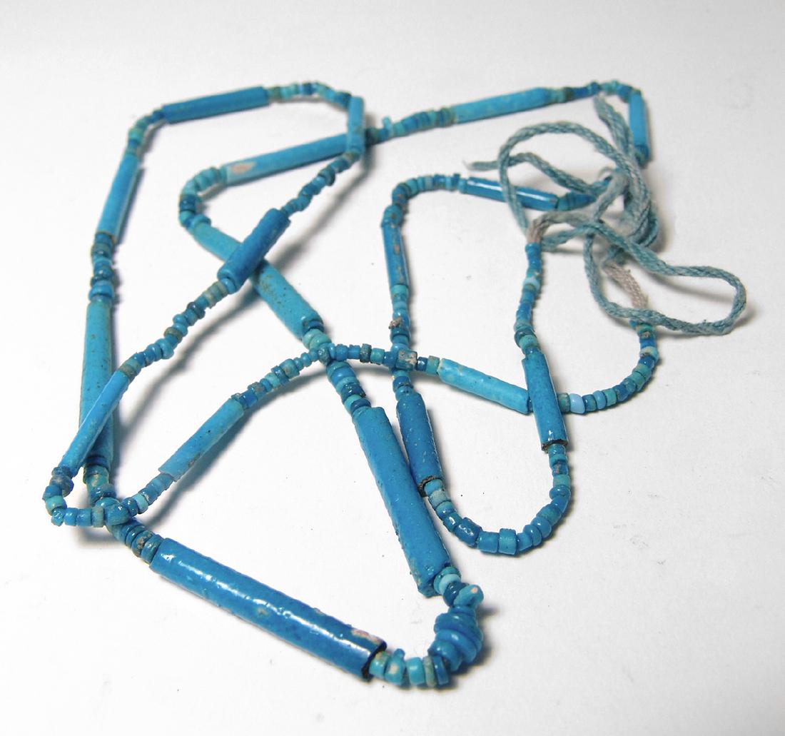 A gorgeous strand of Egyptian faience beads: A gorgeous strand of Egyptian faience beads. The beads are quite varied and date from the New Kingdom through the Late Period, c. 1570 - 332 BC, and include faience tubular beads of a heavy stock and 