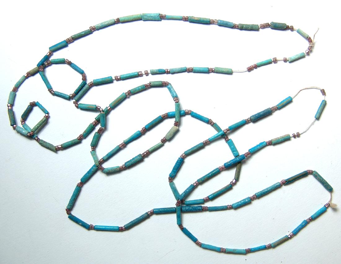 A nice pair of Egyptian beaded necklaces: A nice pair of Egyptian beaded necklaces. The Egyptian faience tube beads, Late Period, c. 664 - 30 BC, in shades of light turquoise blue are strung with light purple faceted beads from a later period