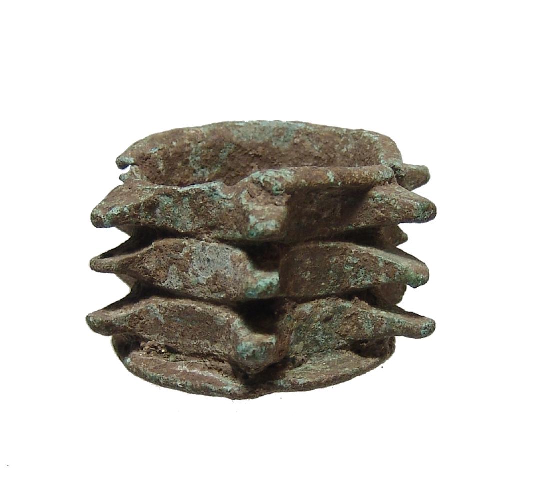 A nice Roman bronze cylindrical mace head: A nice Roman bronze cylindrical mace head, 3rd - 1st Century BC, with 6 series of three projections in equally spaced rows, the shaft hole with rounded edge on one side. 1 1/8 x 2 in (2.8 x 5.1 cm). N