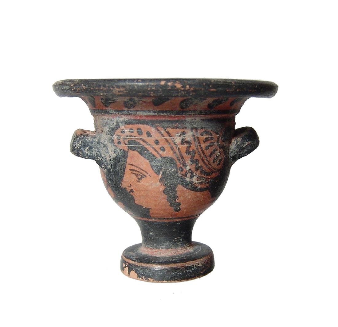 A cute miniature Greek red-figure votive bell krater: A cute miniature Greek red-figure votive bell krater, 4th Century BC, depicting a lady of fashion on one side and a nude male on the other. Nicely painted and a pleasing example with minor surface los