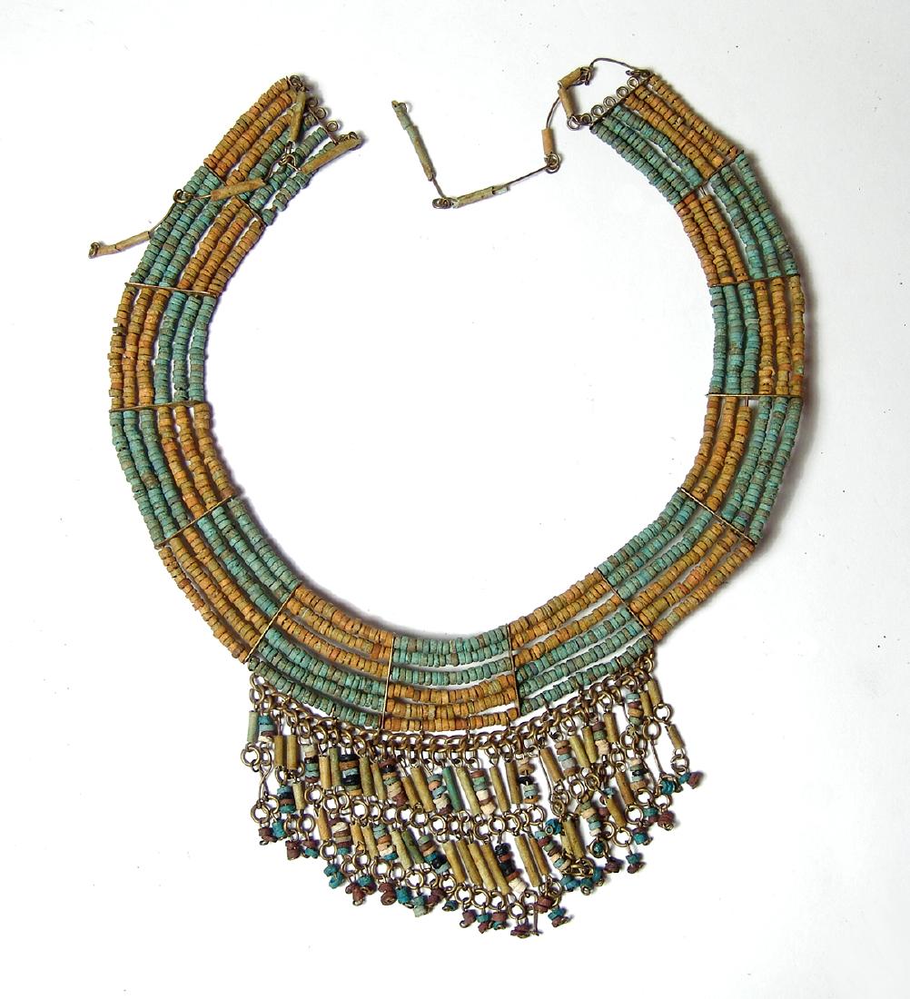 An antique beaded collar in ancient Egyptian style: An antique beaded collar in ancient Egyptian style. Of mid-20th Century construction, the beads are nicely strung on a wired frame. 7 x 9 in (17.8 x 22.8 cm). Ex Rhode Island private collection.