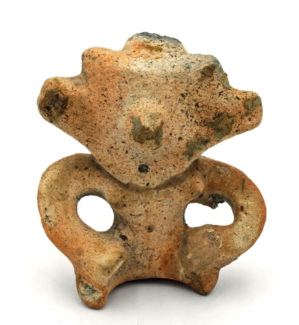 A fine Quimbaya figure from Colombia: A fine Quimbaya figure from Colombia, c. AD 1000 - 1500. This seated female is depicted with hands resting on her thighs, he facial features nicely detailed. H: 3 3/4 in (9.5 cm). Well-preserved with 