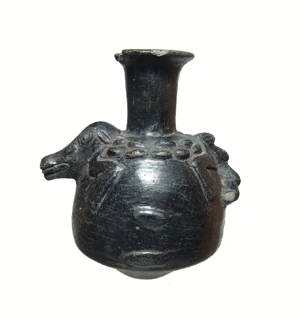 A nice Inca black-ware ceramic aryballos: A nice Inca black-ware ceramic aryballos, c. AD 1400 - 1500, the top of the vessel adorned with a caiman in relief and the surfaces are nicely burnished. 4 7/8 x 4 3/8 in (12.4 x 11.2 cm). Light depos