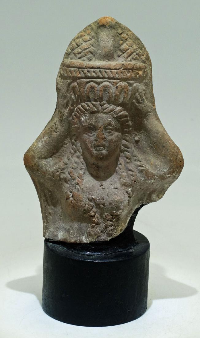 Detailed Romano-Egyptian terracotta figure: A wonderfully detailed Romano-Egyptian terracotta figure c. 1st - 2nd Century AD. The figure is 4 1/4 in high and depicts a woman carrying a basket of fruit atop her head. The figure is nicely detaile