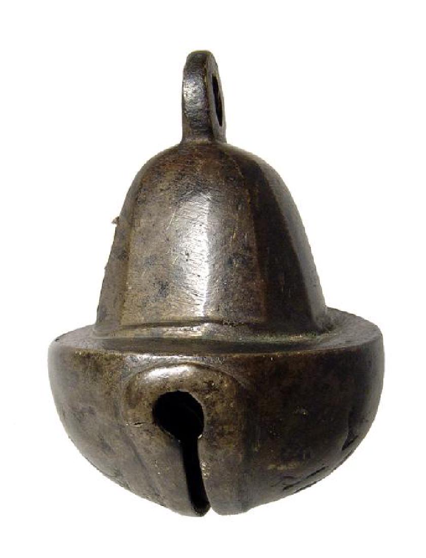 An Armenian antique brass mule's bell: An Armenian antique brass mule's bell, c. 19th Century, of solid construction with strong tone and attractive patination. 4 1/2 x 3 1/8 in (11.4 x 7.9 cm). Ex Los Angeles private collection.