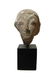 A Levantine limestone head, possibly a Pharaoh