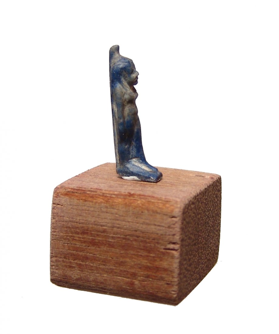 Egyptian lapis lazuli amulet of the goddess Serqet: A beautiful Egyptian lapis lazuli amulet of the goddess Serqet, Late period, c. 664 - 332 BC, who was one of the four protectresses of the dead, she is depicted standing with tight-fitting gown and wi