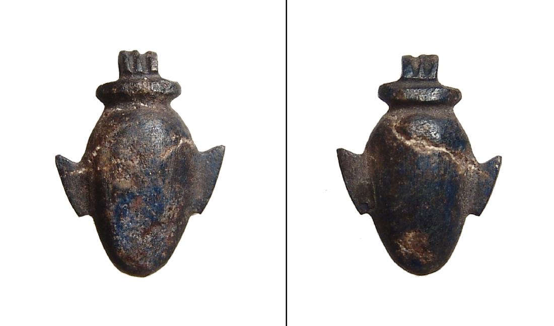 An Egyptian basalt ib heart amulet, Late Period: An Egyptian basalt ib heart amulet, Late Period, c. 664 - 332 BC, nicely carved with a natural fissure running through the stone. L: 18 mm. Light deposits. Ex Boston Museum of Fine Arts de-accession;