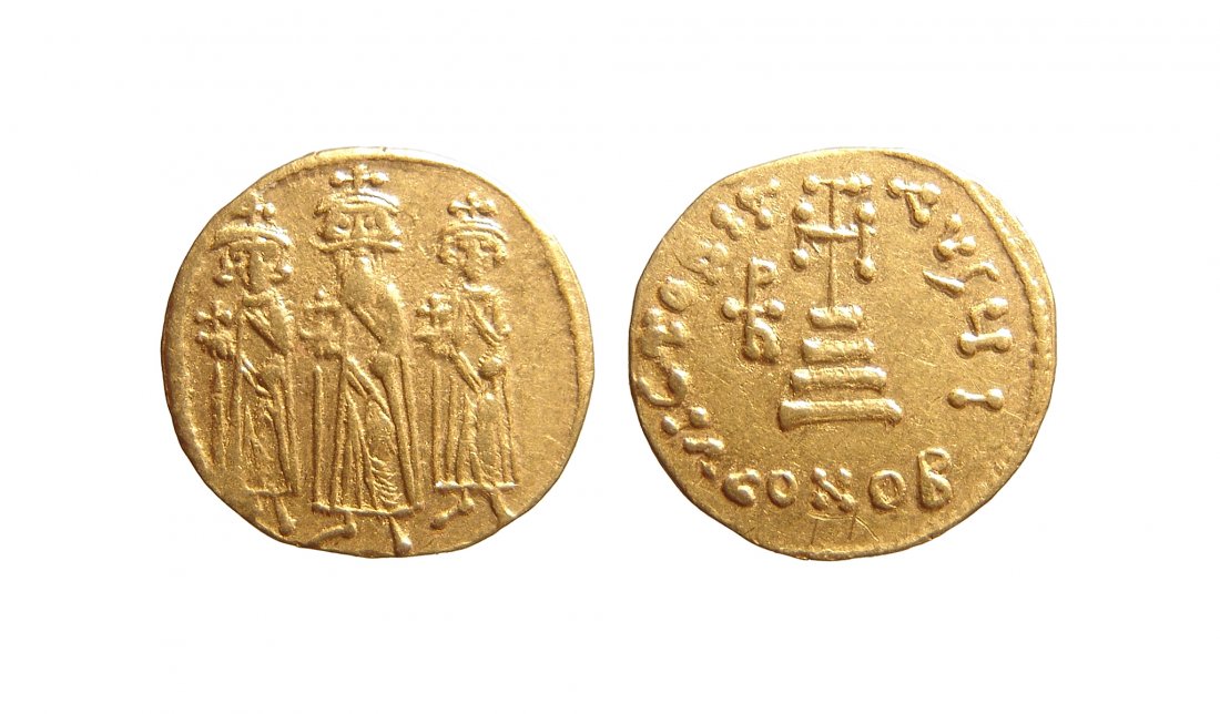 A Byzantine gold solidus of Heraclius: A Byzantine gold solidus of Heraclius, AD 610 - 641, struck at Constantinople. (4.38g, 19 mm). The front of the coin features crowned figures of Heraclonas, Heraclius, and Heraclius Constantine standi