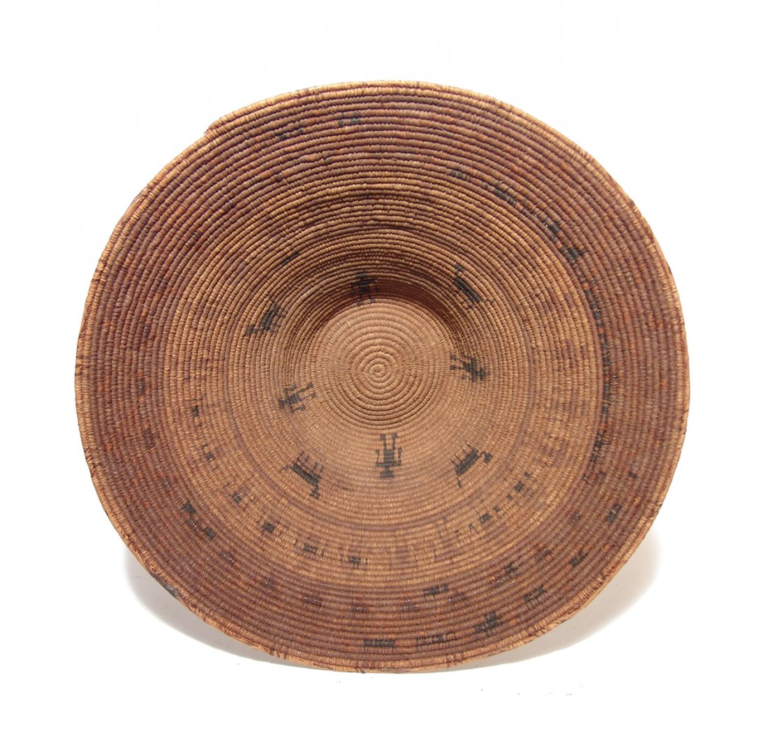A large and attractive Navajo basket: A large and attractive Navajo basket, late 19th - early 20th Century, finely woven with human and animal figures in black, both inside and outside. Dia: 14 3/4 in (37.4 cm). In choice condition! Ex Co