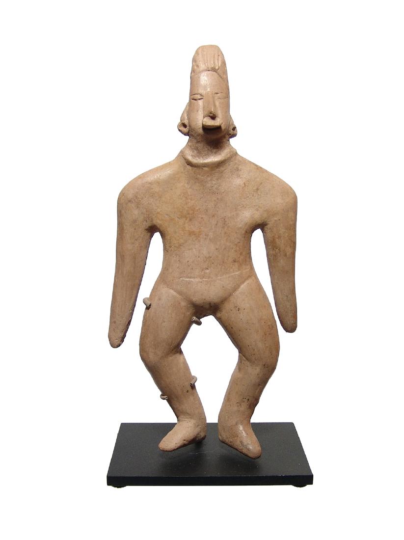 Huge Colima standing male 'gingerbread' type figure: A huge Colima standing male 'gingerbread' type figure, West Mexico, c. 100 BC - AD 250, wearing a speedo type shorts with ear spools, nose ring and a necklace. A large and impressive example with nice