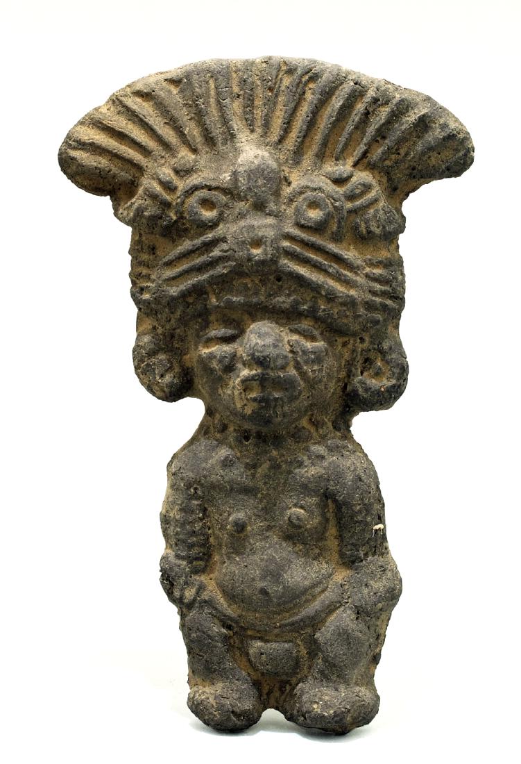 A choice Toltec figure from Mexico: A choice Toltec figure from Mexico, c. AD 600 - 1200, a nice standing figure depicting a male adorned with a complex deity headdress, large ear ornaments and jewelry. H: 4 3/8 in (11.2 cm). Good miner