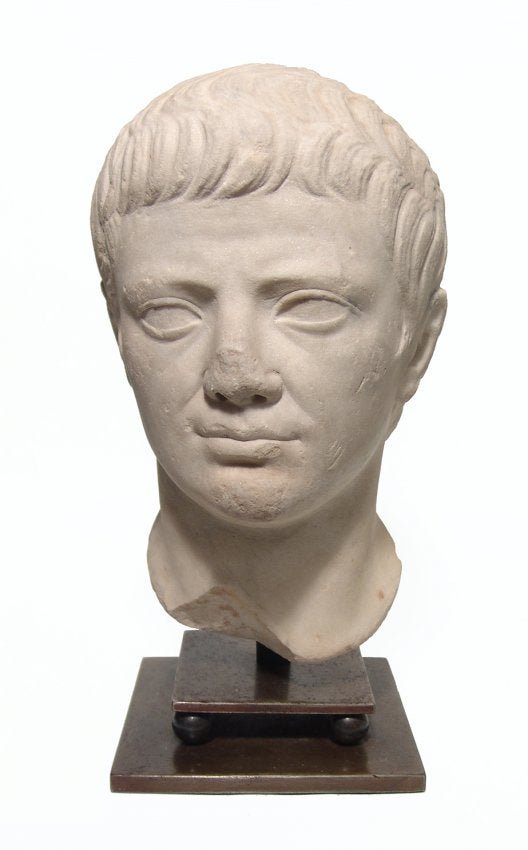 A choice Roman marble head of a man, Julio-Claudian: A choice Roman marble head of a man, Julio-Claudian, c. early 1st Century AD, the features handsomely modeled with short cropped hair treated at the forehead in a similar fashion as portraits of the e