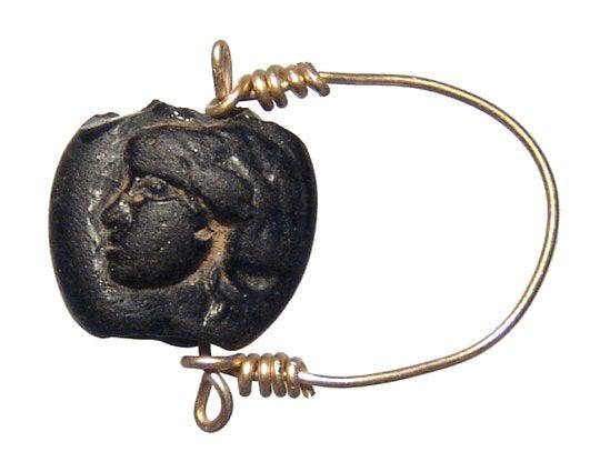 Roman glass bead with female head in relief (1 of 2)