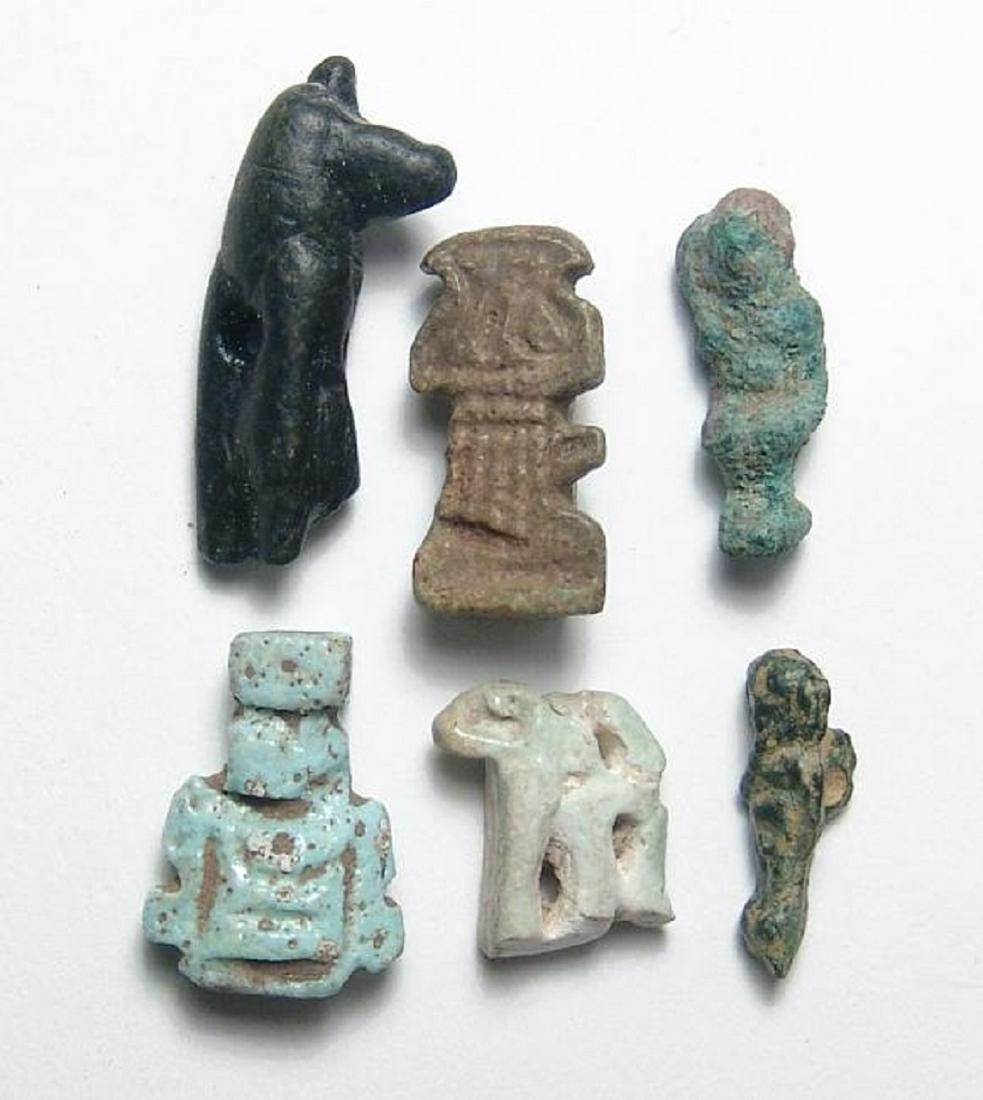 6 Egyptian bronze, stone and faience amulets: A neat group of 6 Egyptian bronze, stone and faience amulets, Late period, c. 664 - 30 BC, including a nicely detailed stone Anubis amulet, two bronze Harpokrates amulets, two faience amulets depictin