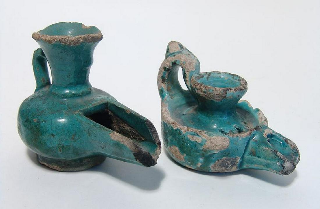 A pair of Persian/Islamic glazed lamps: A pair of Persian/Islamic glazed lamps, c. 10th - 11th Century, both with nice turquoise-colored glaze. One with long channel spout and tall fill-hole, 4 1/4 x 3 1/2 in (10.7 x 8.9 cm), the second wit