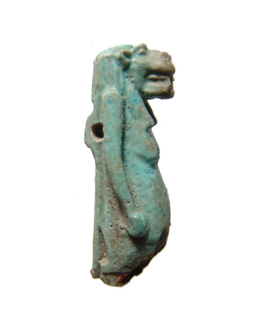 Egyptian light blue faience amulet of Taweret: An Egyptian light blue faience amulet of Taweret, Late Period, c. 664-30 BC, with the head of a hippopotamus and her pregnant belly framed by her hands. Wonderfully detailed face and decoration on bac