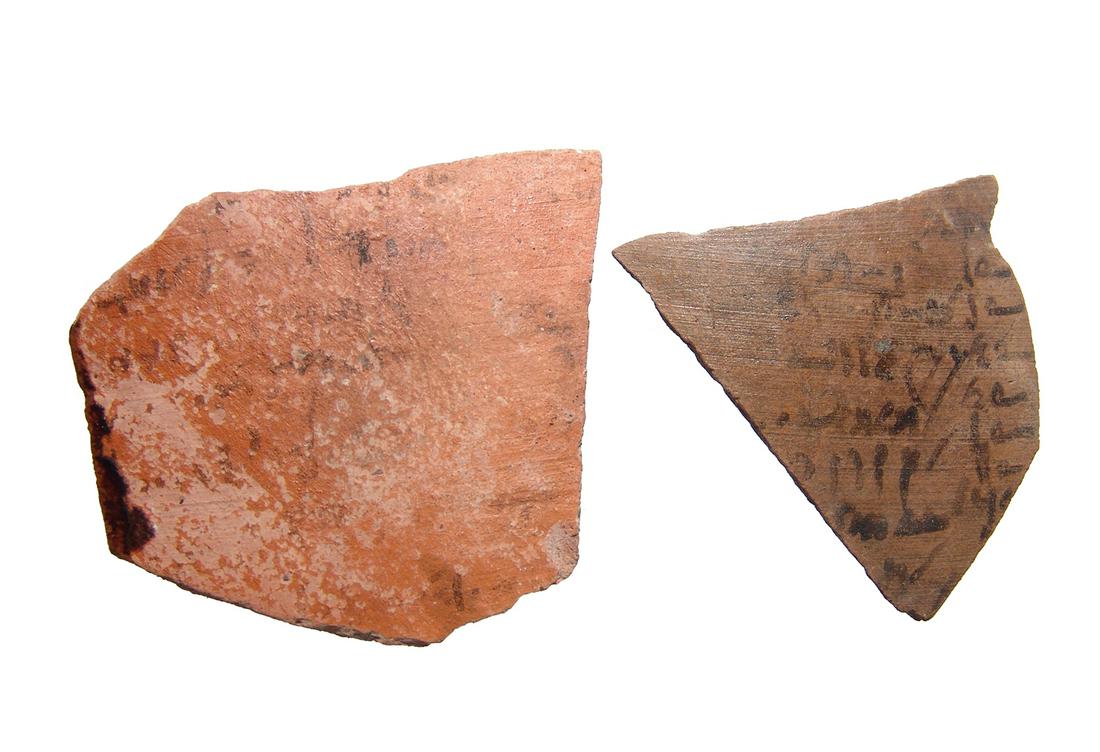Pair of Egyptian pottery ostraca with Demotic script: A pair of Egyptian pottery ostraca with Demotic script, Ptolemaic, c. 4th - 1st Century BC, the larger with five partial lines of text and the other multiple lines with what appears to be accounting o