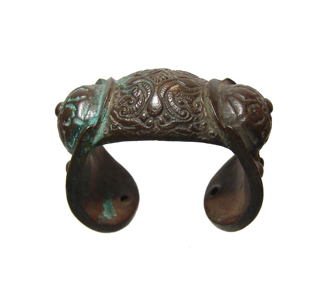 A nice Macedonian / Thracian bronze fertility bracelet: A nice Macedonian / Thracian bronze fertility bracelet, Medieval, 14th - 16th Century, given from mother to her daughter upon her wedding and to be worn until she bears her first child. Large central 